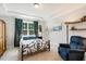 Comfortable bedroom with tray ceiling, carpeted floor, and a decorative wrought iron bed frame at 149 Ivory Ln, Raleigh, NC 27610