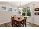 Inviting dining nook with wood floors, natural light, and a view of the outdoors at 149 Ivory Ln, Raleigh, NC 27610