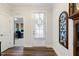 Entryway with hardwood flooring, leading to an office, and white trim at 149 Ivory Ln, Raleigh, NC 27610