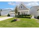 Lovely home showcasing green lawn, trimmed shrubs, and a cozy covered porch at 149 Ivory Ln, Raleigh, NC 27610