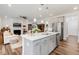 Open concept kitchen flowing into the living room with a fireplace at 149 Ivory Ln, Raleigh, NC 27610