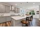 Open kitchen featuring an island with seating and modern stainless steel vent hood at 149 Ivory Ln, Raleigh, NC 27610