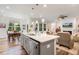 Open concept kitchen with stainless steel dishwasher and view of living room at 149 Ivory Ln, Raleigh, NC 27610