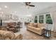 Open-concept living room flows into a modern kitchen and dining area, perfect for entertaining at 149 Ivory Ln, Raleigh, NC 27610