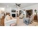 Spacious living room with a fireplace, built-in bookshelves, and neutral decor at 149 Ivory Ln, Raleigh, NC 27610