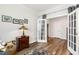 Well-decorated office space with hardwood floors, french doors, and stylish desk at 149 Ivory Ln, Raleigh, NC 27610