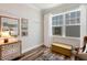 Charming office with wood floors, a cushioned bench, and natural light from a large window at 149 Ivory Ln, Raleigh, NC 27610