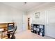 Bright office space with built in shelving, an open doorway, and a neutral palette at 149 Ivory Ln, Raleigh, NC 27610