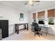 Well-lit office space with dual desk setup, two windows and ceiling fan at 149 Ivory Ln, Raleigh, NC 27610