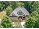Aerial view of the beautiful home surrounded by lush trees in a peaceful setting at 150 Luxorwind Dr, Garner, NC 27529
