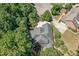 Aerial view of the home with landscaped yard, surrounded by mature trees at 150 Luxorwind Dr, Garner, NC 27529