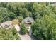 Aerial view of home nestled in the trees on a large lot with cul-de-sac at 150 Luxorwind Dr, Garner, NC 27529