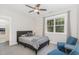 Bedroom features ceiling fan, closet access and a window with backyard view at 150 Luxorwind Dr, Garner, NC 27529