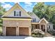 Charming two-story home with a two-car garage, beautiful brick facade and manicured landscaping at 150 Luxorwind Dr, Garner, NC 27529