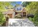 Beautiful two-story home with brick and stone accents, well-maintained landscaping, and an inviting entrance at 150 Luxorwind Dr, Garner, NC 27529