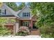 Charming home boasts a stone facade, covered front porch, and well-manicured landscaping at 150 Luxorwind Dr, Garner, NC 27529