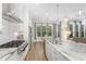 Open-concept kitchen with island, breakfast nook, stainless steel appliances, and ample counter space at 150 Luxorwind Dr, Garner, NC 27529