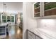 Bright kitchen with granite countertops, island seating, and an open view into the living area at 150 Luxorwind Dr, Garner, NC 27529