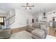 Cozy living room with hardwood floors, open to a modern kitchen, and featuring staircase access at 150 Luxorwind Dr, Garner, NC 27529