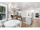 Open living space with dining area, kitchen, and living room, great for entertaining guests at 150 Luxorwind Dr, Garner, NC 27529