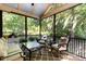 Relaxing screened porch with outdoor seating and views of the lush greenery at 150 Luxorwind Dr, Garner, NC 27529