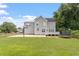Expansive backyard includes patio, basketball court, trampoline, and space for outdoor activities at 1505 Mclaurin Ln, Fuquay Varina, NC 27526