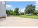 Paved backyard basketball court alongside a well-manicured lawn at 1505 Mclaurin Ln, Fuquay Varina, NC 27526