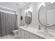 Bathroom features double sinks and a shower with a curtain at 1505 Mclaurin Ln, Fuquay Varina, NC 27526