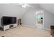 Large bonus room with TV and carpet at 1505 Mclaurin Ln, Fuquay Varina, NC 27526