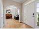 Inviting home entryway with beautiful hardwood floors and modern chandelier at 1505 Mclaurin Ln, Fuquay Varina, NC 27526