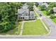 Beautifully landscaped home featuring mature trees and a large front lawn at 1505 Mclaurin Ln, Fuquay Varina, NC 27526