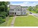 Charming two-story home with well-manicured lawn and mature landscaping at 1505 Mclaurin Ln, Fuquay Varina, NC 27526