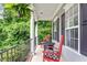 Cozy front porch featuring rocking chairs, hanging plants, and decorative features at 1505 Mclaurin Ln, Fuquay Varina, NC 27526