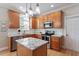 Modern kitchen with granite countertops, stainless steel appliances, and ample cabinet space at 1505 Mclaurin Ln, Fuquay Varina, NC 27526