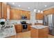 Updated kitchen featuring granite countertops, stainless steel appliances, and a functional island at 1505 Mclaurin Ln, Fuquay Varina, NC 27526