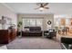 Inviting living room with large windows, fireplace, and hardwood floors at 1505 Mclaurin Ln, Fuquay Varina, NC 27526