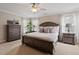 Serene main bedroom with neutral tones, plush carpet, and windows with natural light at 1505 Mclaurin Ln, Fuquay Varina, NC 27526