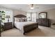 Comfortable main bedroom featuring neutral colors, carpet, and windows with bright natural light at 1505 Mclaurin Ln, Fuquay Varina, NC 27526