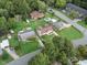 Overhead shot showing a neighborhood with well-maintained homes and lush green landscaping and mature trees at 1709 Hawthorne Lane Ln, Burlington, NC 27215
