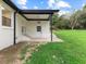 Covered patio with ceiling fan and staircase offers a relaxing spot in the spacious backyard at 1709 Hawthorne Lane Ln, Burlington, NC 27215