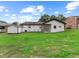 Spacious backyard with lush green grass and a shed, perfect for outdoor activities and storage at 1709 Hawthorne Lane Ln, Burlington, NC 27215