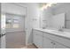 Bright bathroom featuring a double sink vanity with white cabinets at 173 Churchill Way, Clayton, NC 27520