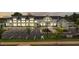 Modern community building exterior featuring ample parking and manicured landscaping at 173 Churchill Way, Clayton, NC 27520