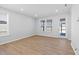 Bright living room featuring hardwood floors and lots of sunlight at 173 Churchill Way, Clayton, NC 27520