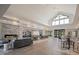 A spacious lounge area with high ceilings, tile flooring, and fireplace at 173 Churchill Way, Clayton, NC 27520