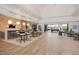Spacious club house with tile floors, and a lounge area with tables, chairs, and billiard table at 173 Churchill Way, Clayton, NC 27520