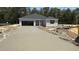 New home construction featuring a long, newly poured driveway and two car garage at 189 Gobbler Dr, Smithfield, NC 27577