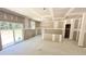 Large living room with sliding glass doors, neutral walls, and recessed lighting ready to be customized at 189 Gobbler Dr, Smithfield, NC 27577