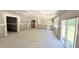 Open living area featuring neutral walls, large windows, and a sliding glass door at 189 Gobbler Dr, Smithfield, NC 27577