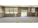 Spacious living room under construction with large windows and sliding glass door at 189 Gobbler Dr, Smithfield, NC 27577